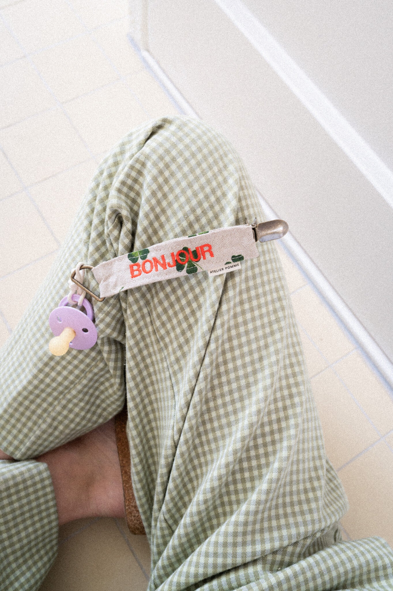 Speenkoord met gepersonaliseerde tekst erop